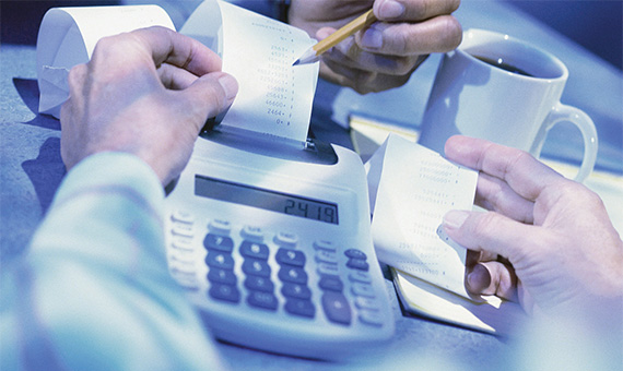 Man Using Calculator